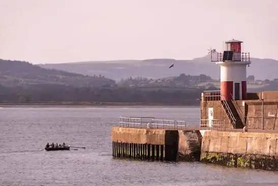 The lighthouse pier at Wicklow harbour on a calm day